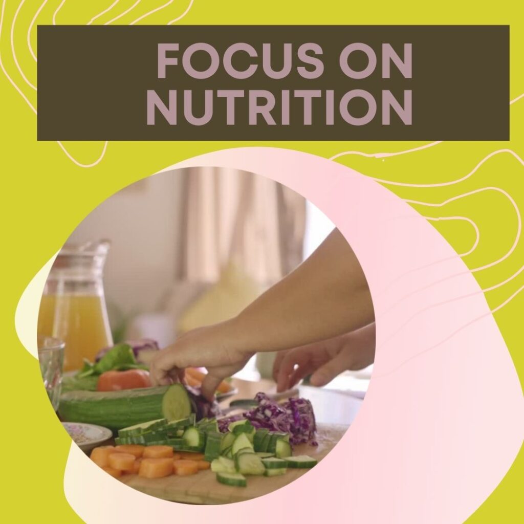 image of a hand cutting veggies on a cutting board for nutrition and holistic wellness