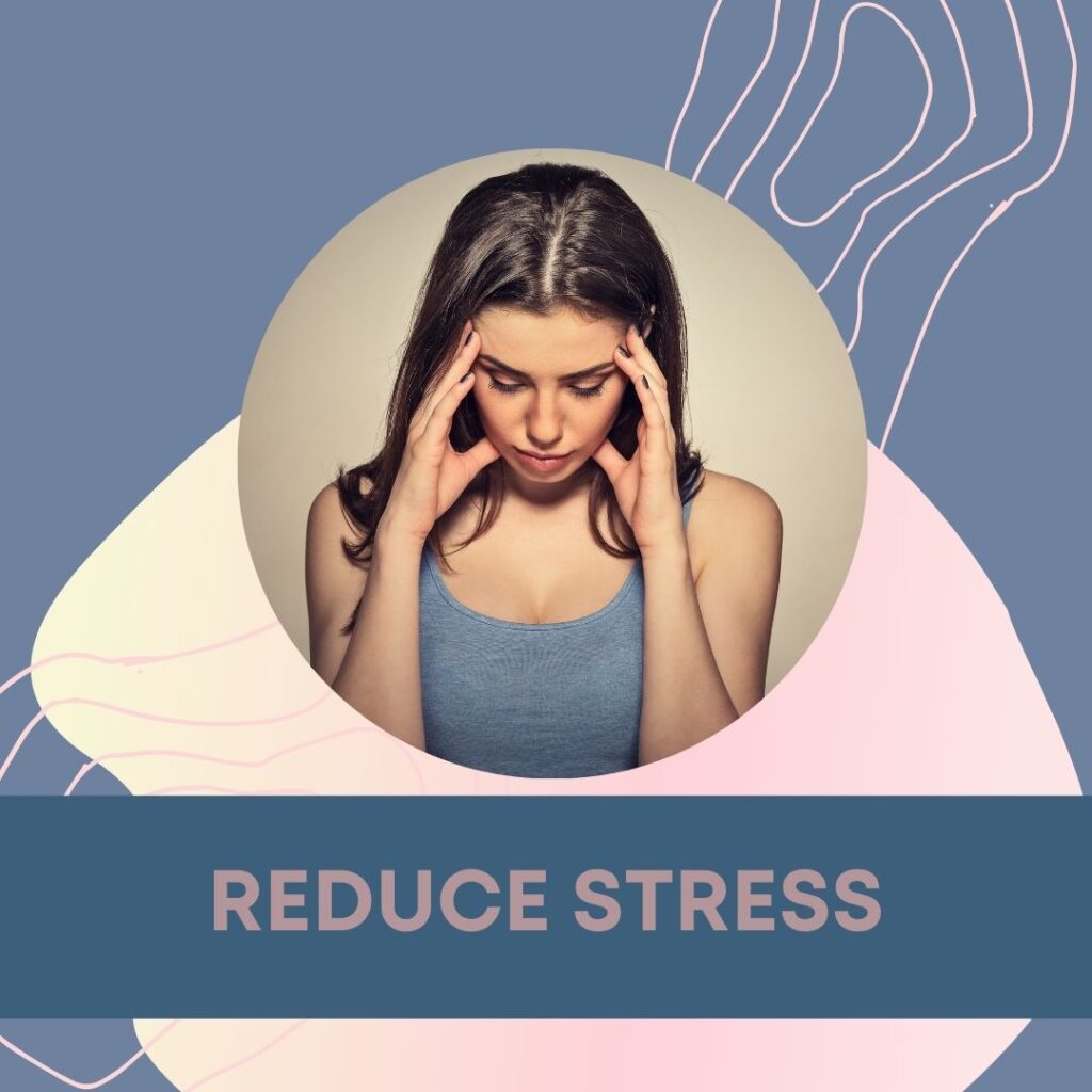 woman wearing a cami holding her head as if stressed