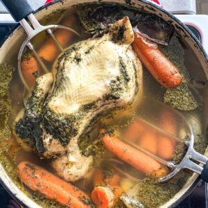 chicken in a stock pot of bone broth