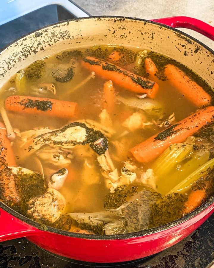 How to make nourishing bone broth on the stove using a whole chicken ...