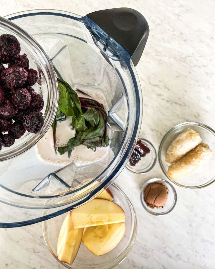 beet greens smoothie ingredients in a blender