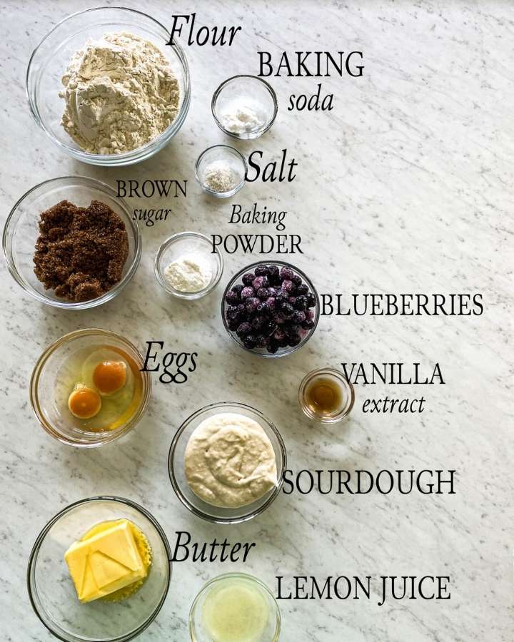 ingredients for sourdough blueberry muffins in glass bowls