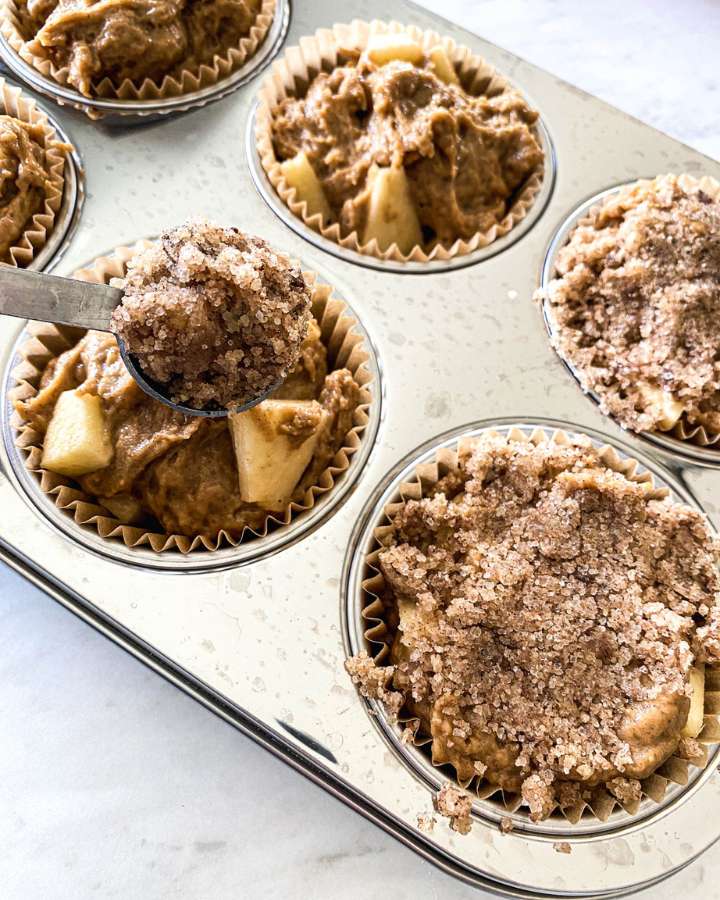 unbaked muffins in a tin