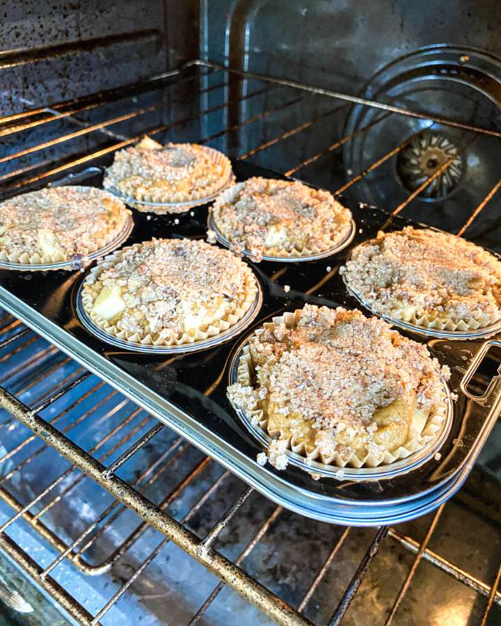 sourdough apple spice muffins in an oven