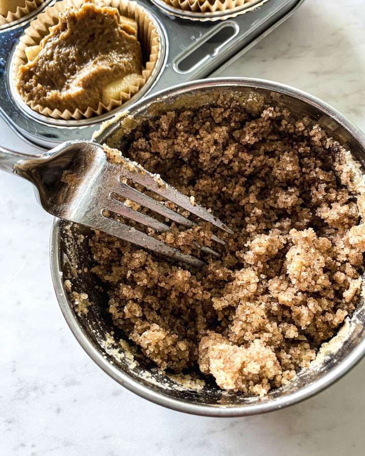 ingredients being mixed in a bowl with a fork 