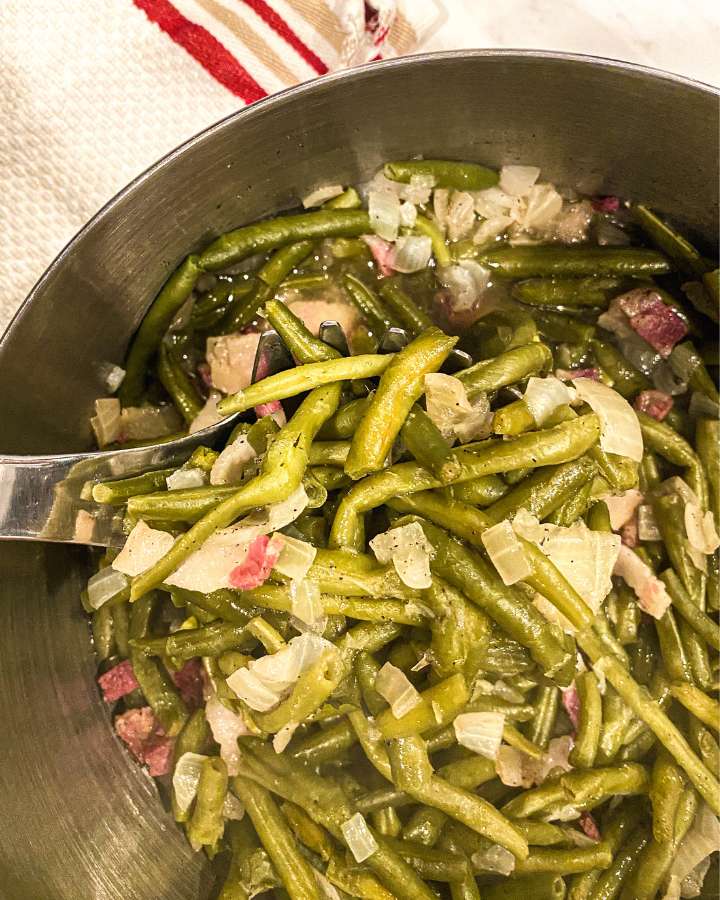 cooked green beans in a stock pot