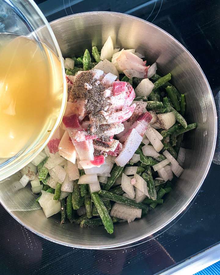 green beans, bacon, and onions in a stock pot