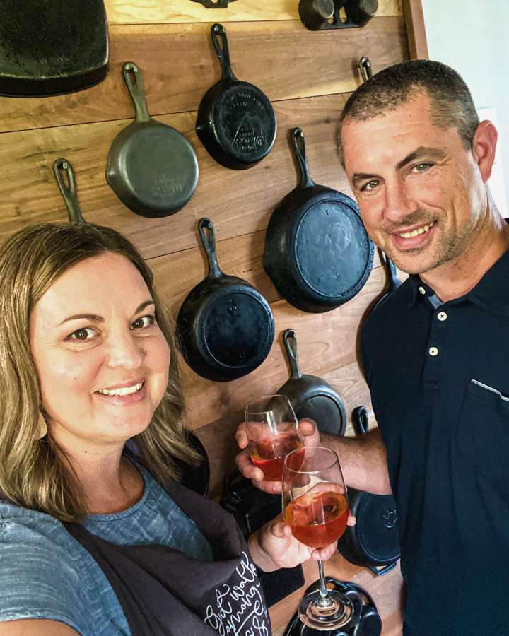 woman and man holding wine glasses